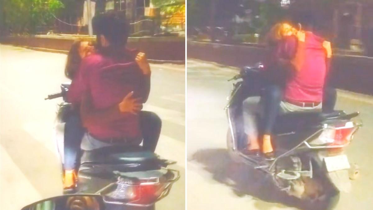 चलती स्कूटी पर युवक और युवती रोमांस करते नजर आए