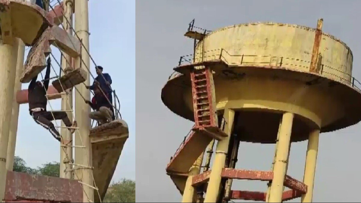 युवक को टंकी से नीचे उतारती पुलिस.