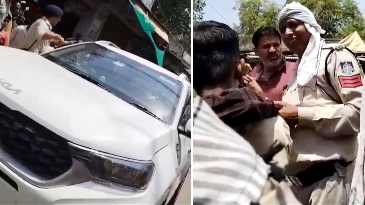 पुलिसकर्मी से अभद्रता करता कार चालक.