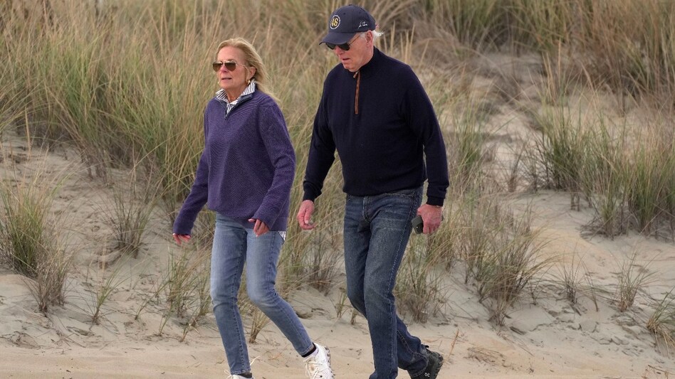 President Joe Biden was walking on the sandy beach with his wife President Joe Biden was walking on the sandy beach with his wife
