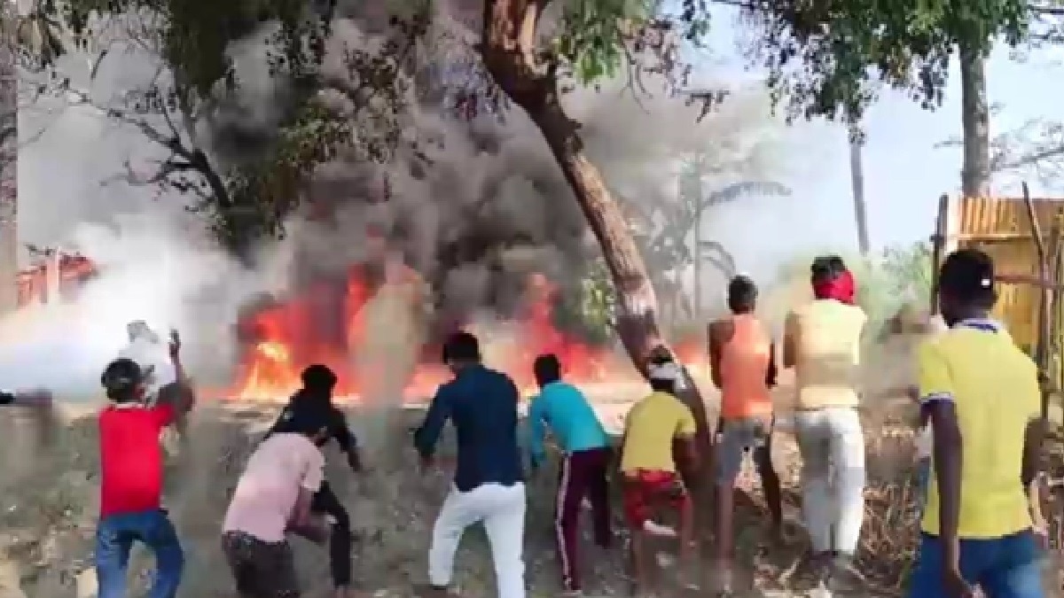 crowd trying to control fire