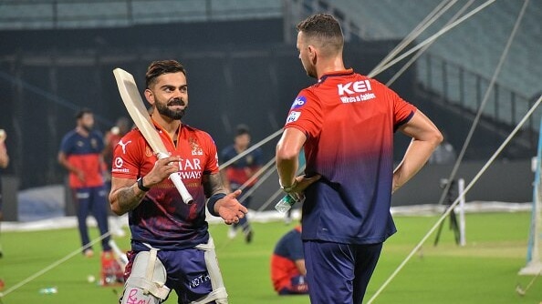 Virat Kohli and Josh Hazlewood are seen during a practice session of Royal Challengers Bangalore 