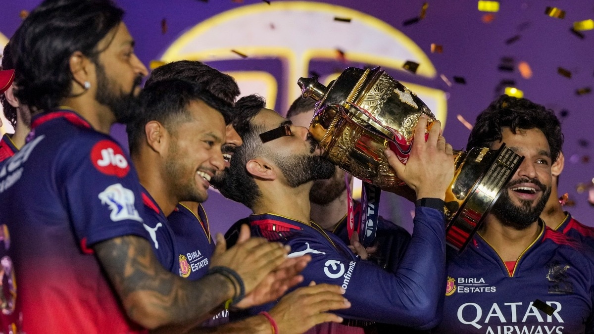 Virat Kohli holds IPL trophy as captain Rajat Patidar and others celebrate during the presentation ceremony of IPL 2025 (PTI)