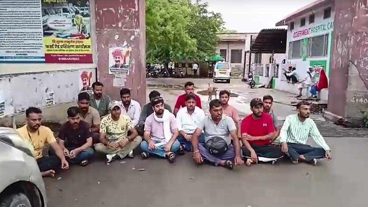 men protesting outside hospital