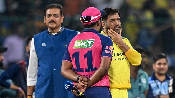 MS Dhoni (R) speaks with his Rajasthan Royals' counterpart Sanju Samson (C) during the toss before the start of the Indian Premier League (IPL) Twenty20 cricket match between Chennai Super Kings and Rajasthan Royals 