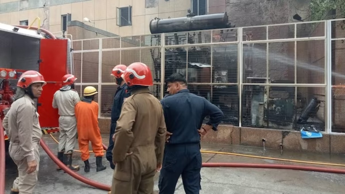 Fire brigade personnel extinguishing the fire at AIIMS Trauma Centre in Delhi