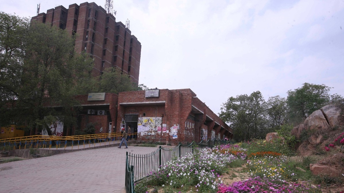 image shown a university campus with garden and building