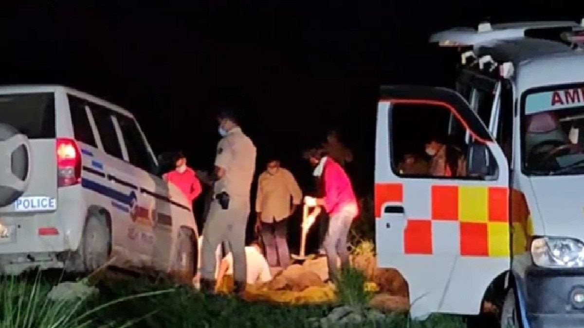 Police team digging grave