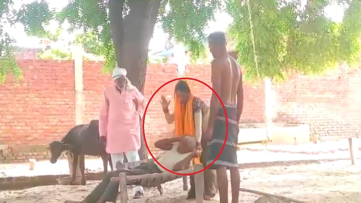 woman beating old man