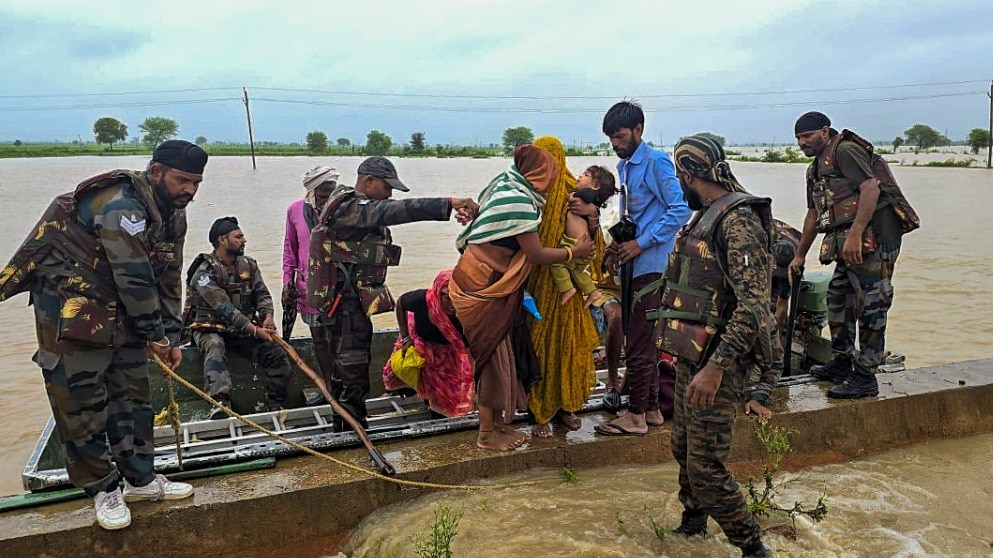 Army personnel rescue people from a flood-affected area in Shivpuri district, Madhya Pradesh (PTI File Photo)