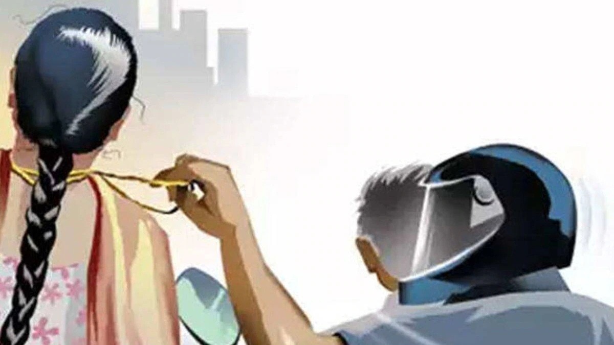 man snatching chain