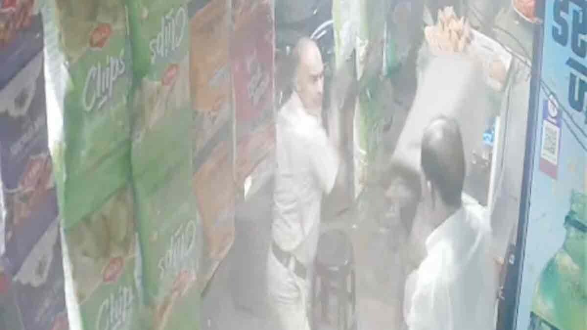 Policeman beaten shopkeeper with stick