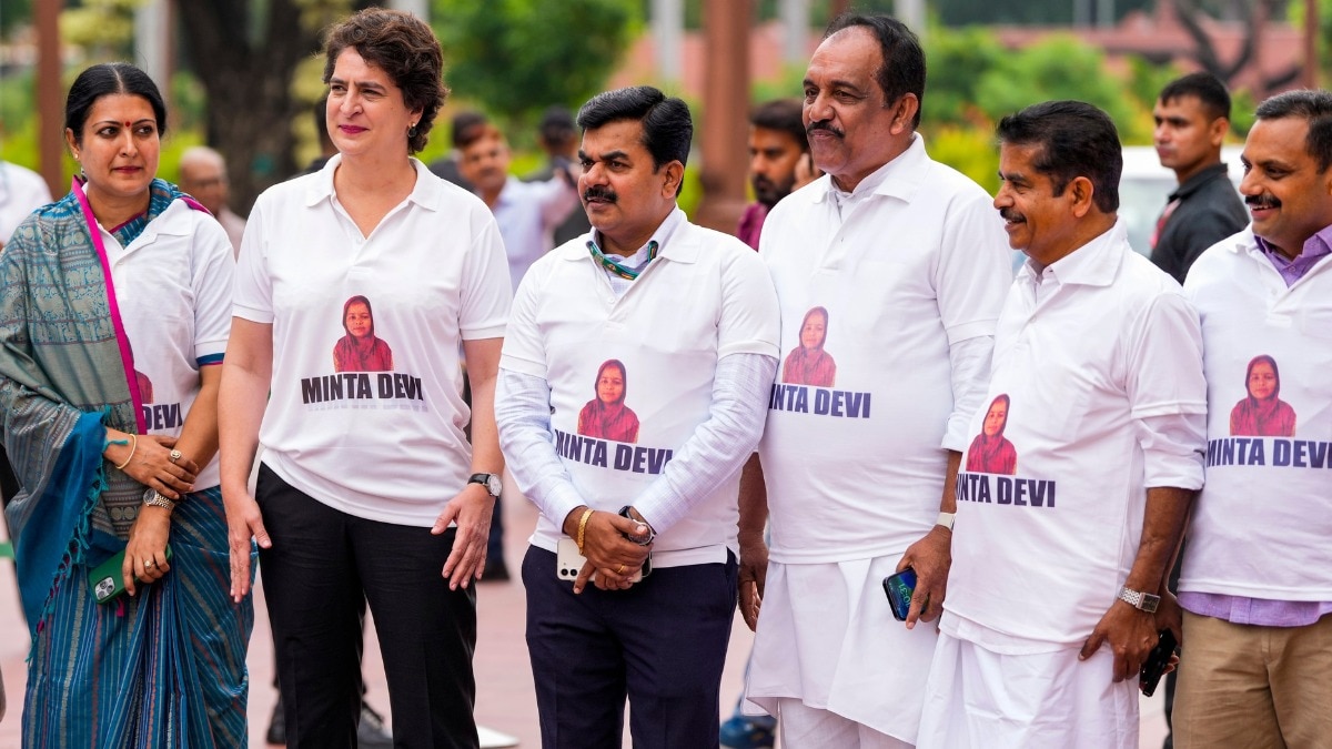 India Block MPs wearing T-shirts with Minta Devi's name and photo, protesting against Bihar in the Parliament House complex