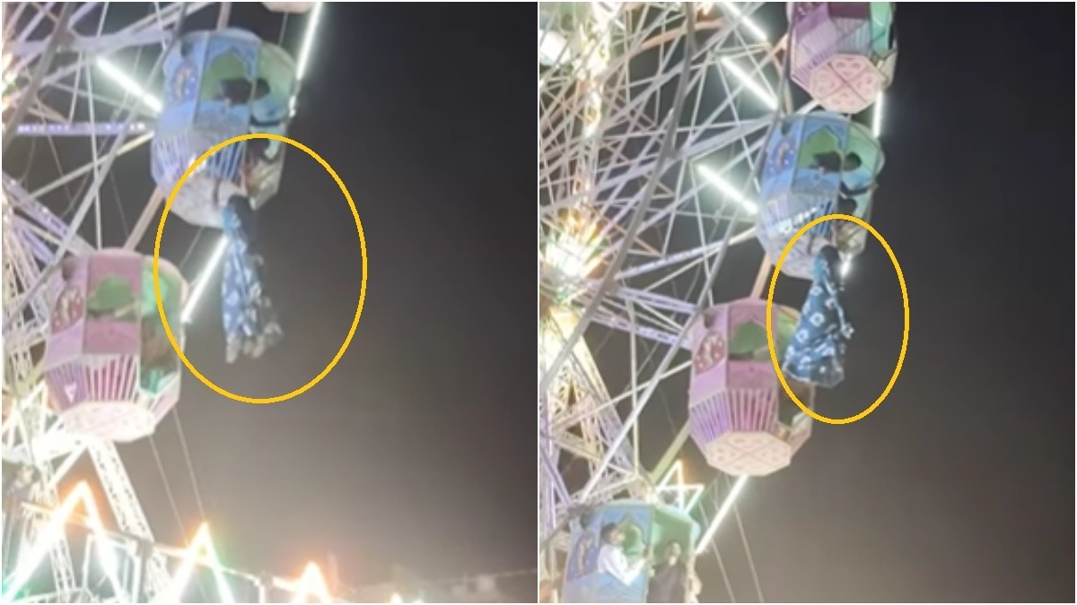 Woman hanging from Ferris wheel