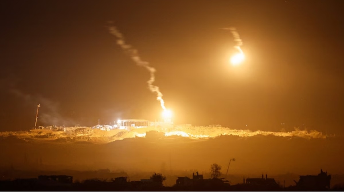 Flares fired by Israel Defense Forces light the sky above Gaza as seen from the Israeli side of the border. 
