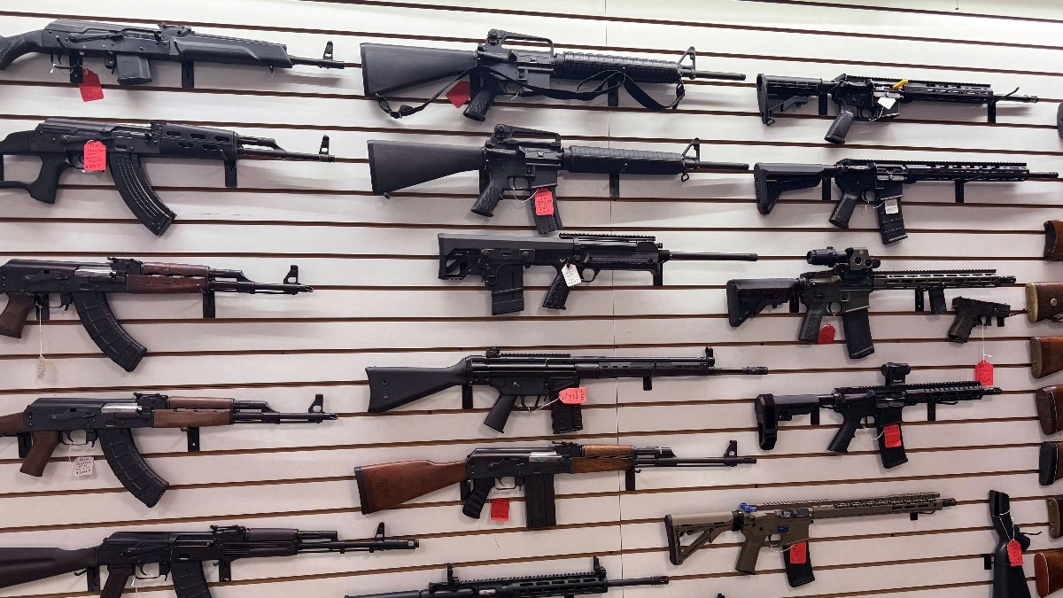 Weapons hang on display for sale at a gun shop in Florida, US