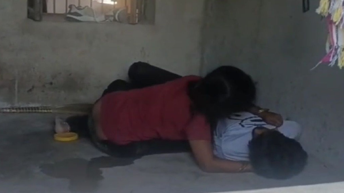 woman crying holding dead body