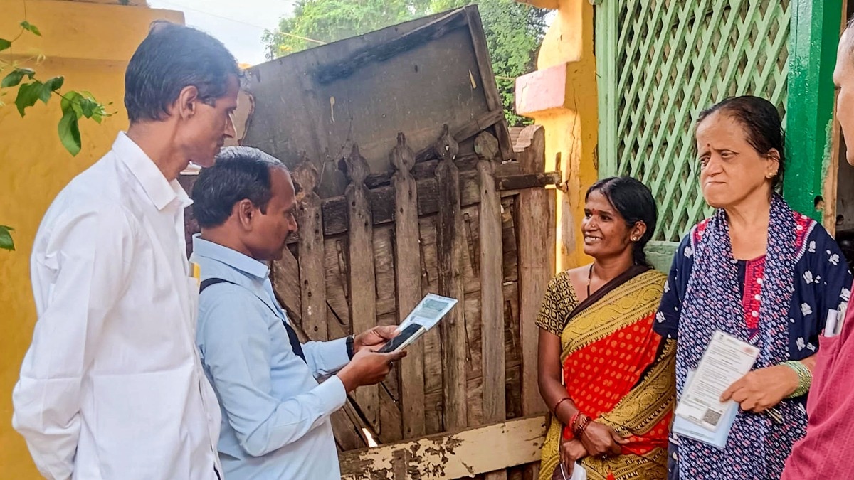 Officials interact with a family during the caste census in Hubballi (Photo: PTI)