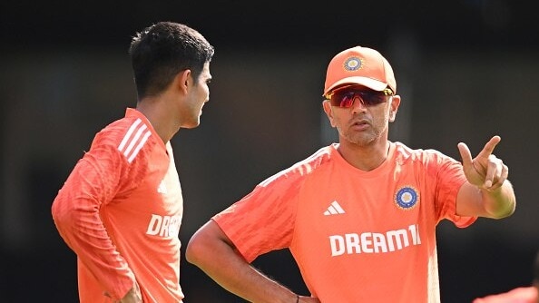 Rahul Dravid, Coach of India speaks with Shubman Gill of India during the ICC Men's Cricket World Cup India 2023 India Net Session at M. Chinnaswamy Stadium on November 08, 2023 in Bangalore, India. 