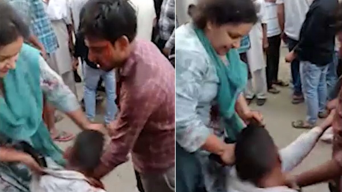 पति-पत्नी ने युवक को जमकर पीटा. (Photo: Screengrab)