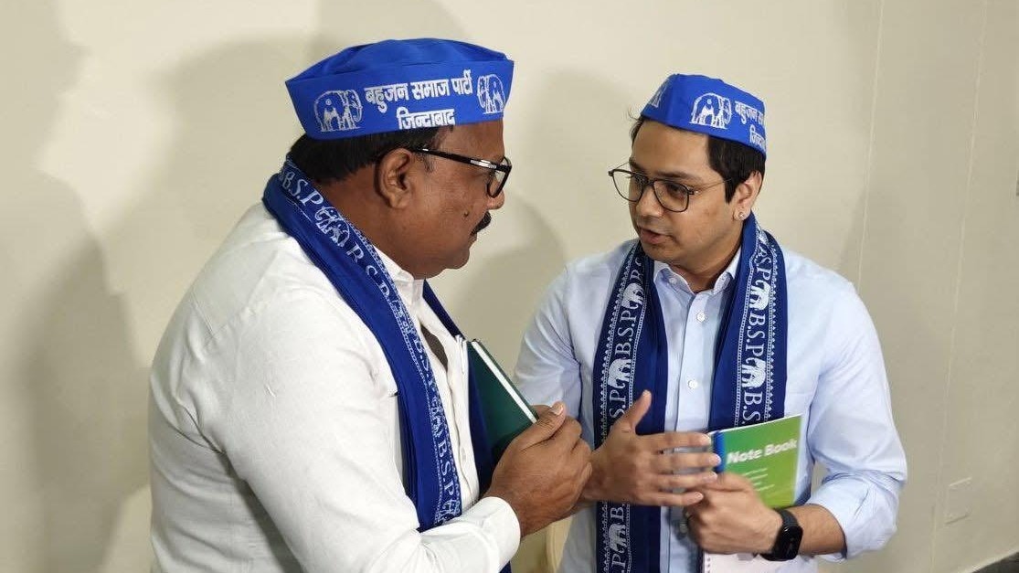 BSP leaders wear party caps.