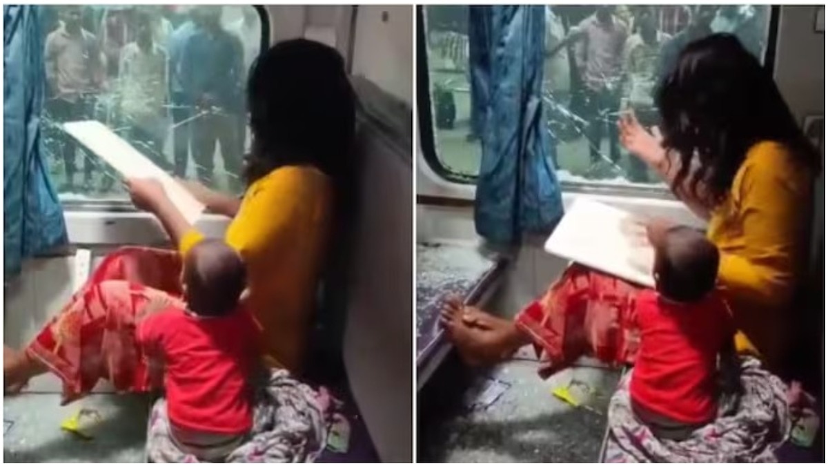 Distressed woman breaks train window after purse theft, with her young child by her side