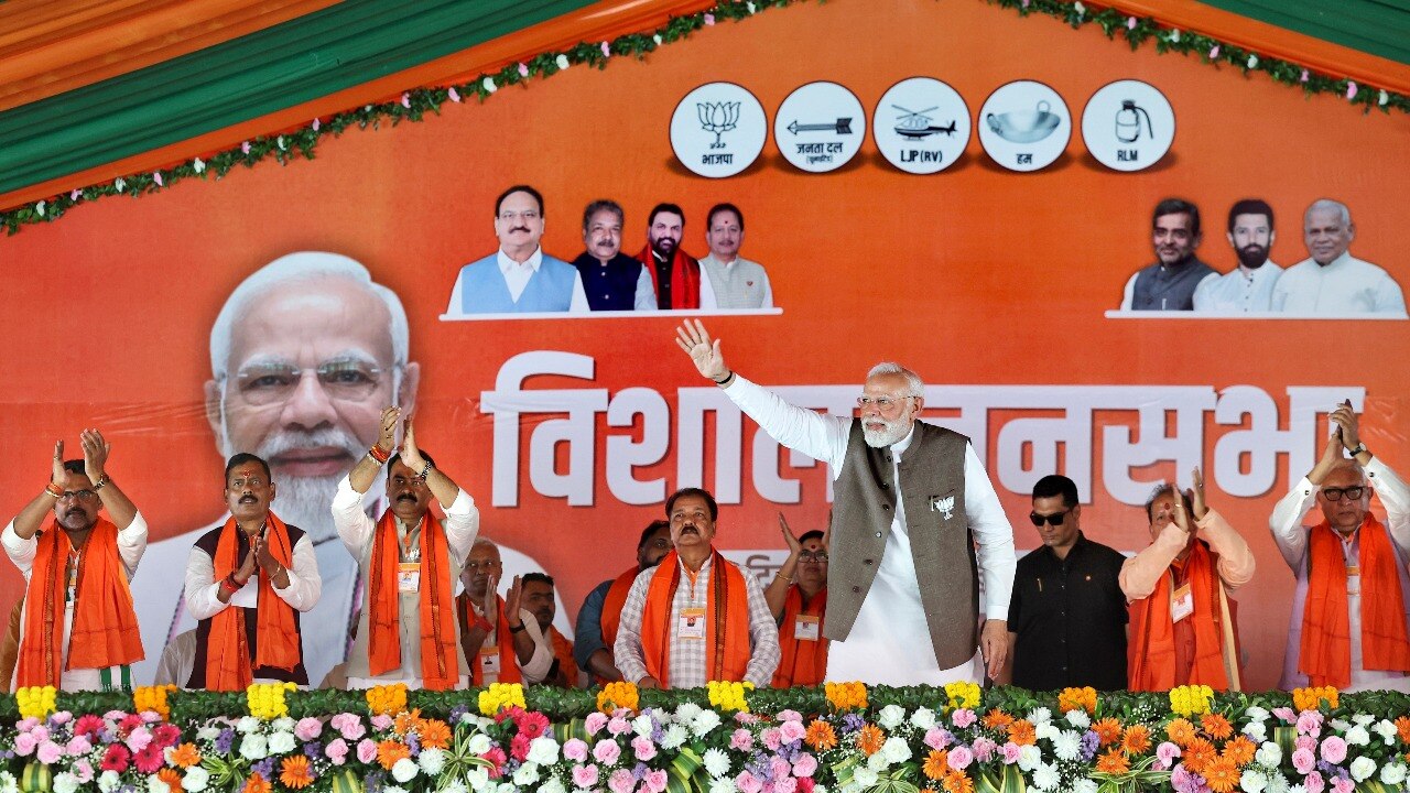 Prime Minister Narendra Modi greeets the gathering during a public meeting ahead of the Bihar Assembly elections, in Begusarai district. (PTI/FILE)