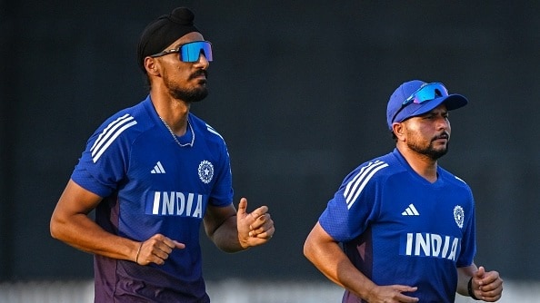 Arshdeep Singh (L) and Kuldeep Yadav attend a practice session