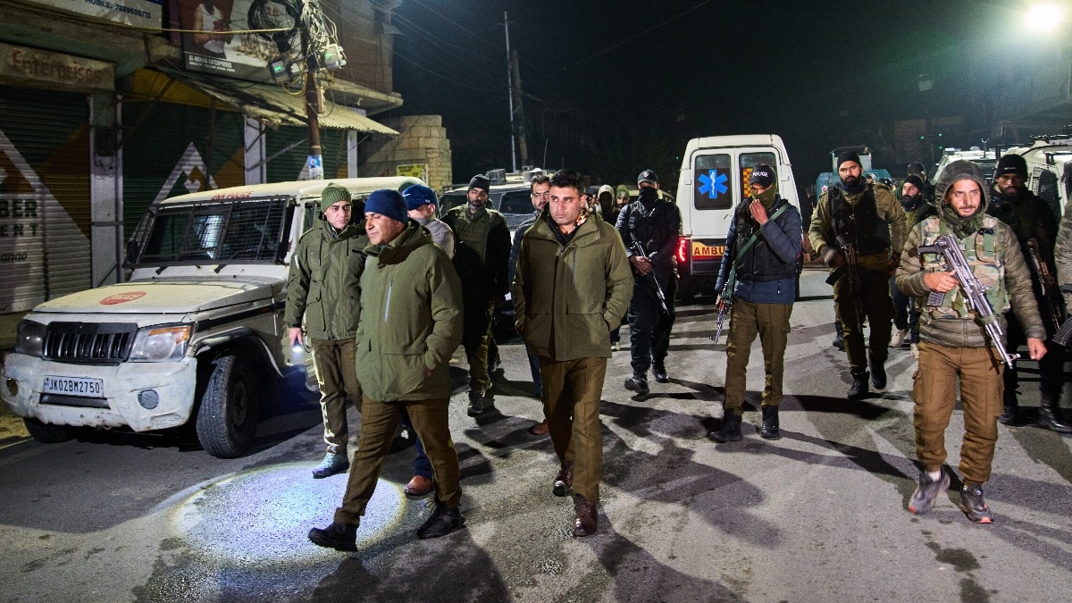 Indian security forces stand near the site of an explosion inside a police station in Nowgam Srinagar