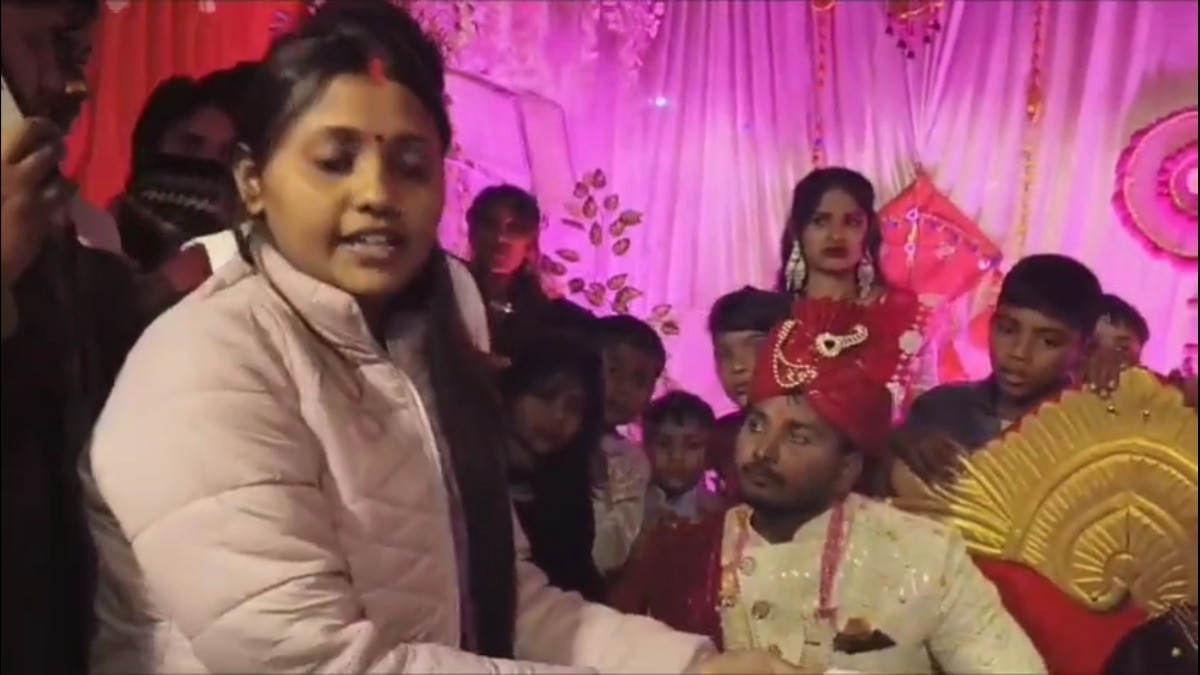 The groom was getting married when the first wife arrived.