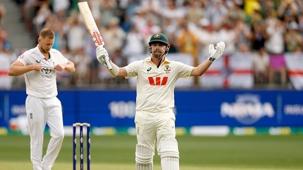 Travis Head of Australia raises his bat after scoring 100 runs during day two of the First 2025/26 Ashes Series Test Match between Australia and England at Perth Stadium on November 22, 2025
