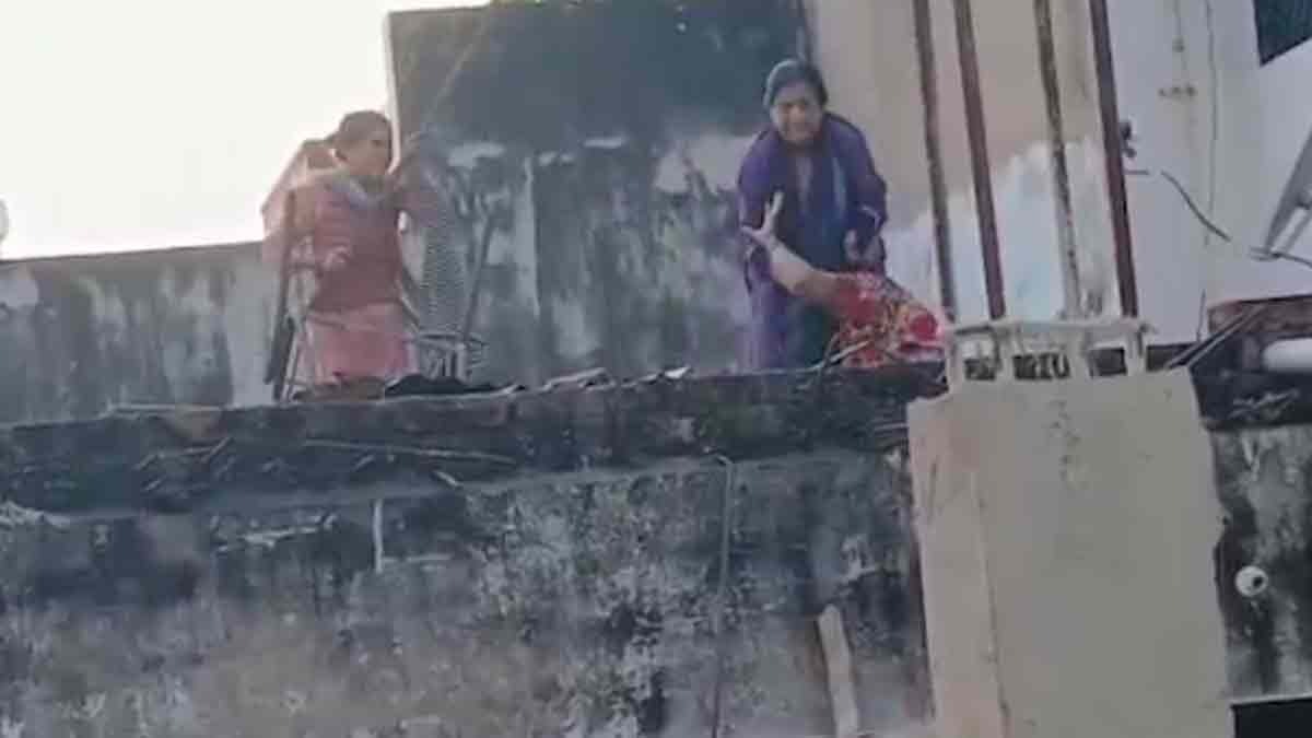 The neighboring women kept hitting the wife with sticks