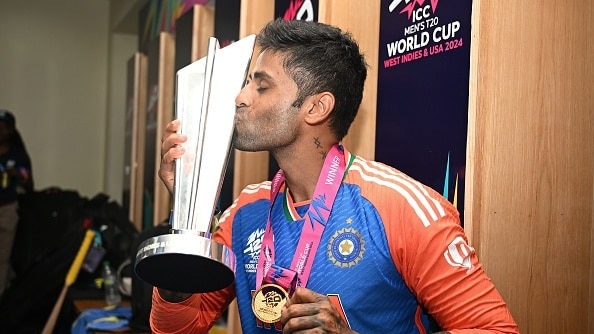  Suryakumar Yadav of India poses with the ICC Men's T20 Cricket World Cup Trophy following the ICC Men's T20 Cricket World Cup West Indies & USA 2024 Final match between South Africa and India