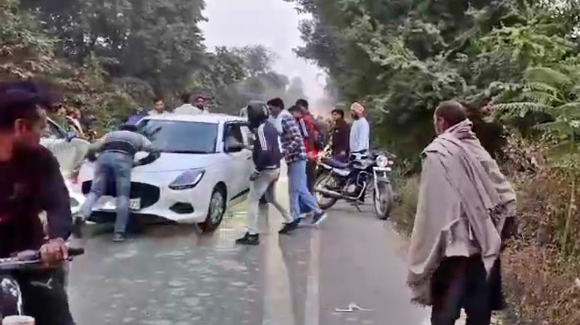 car driver dragged the biker on the bonnet (Photo- Screengrab)