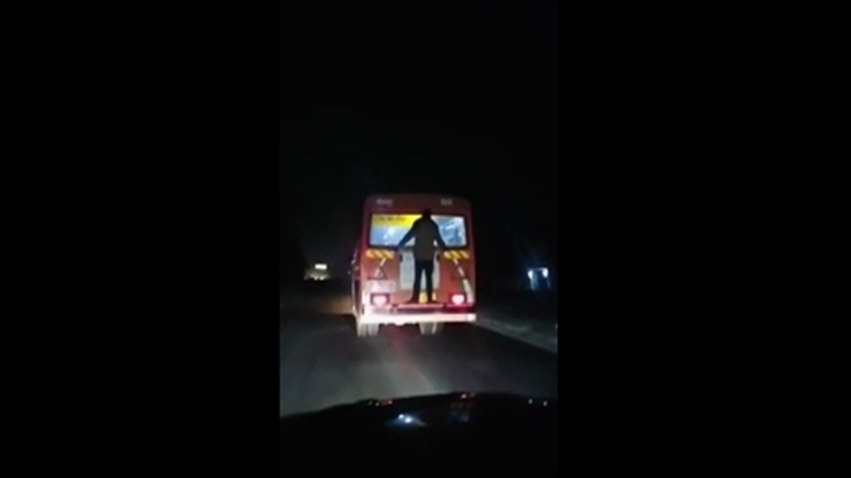 man behind roadways bus