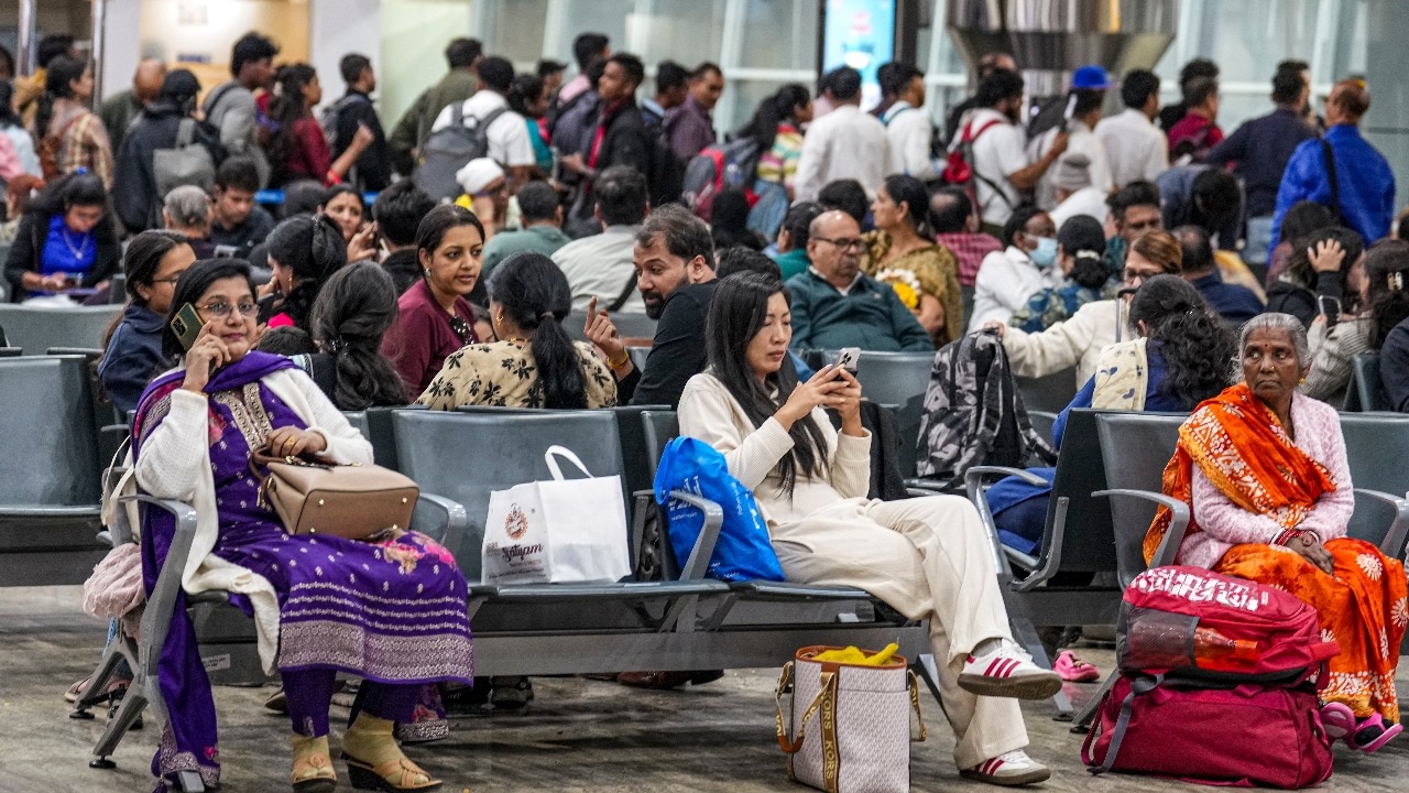 Passengers wait at Raipur's Swami Vivekananda Airport amid flight disruptions. IndiGo on Thursday cancelled more than 300 domestic and international flights. (PTI Image)