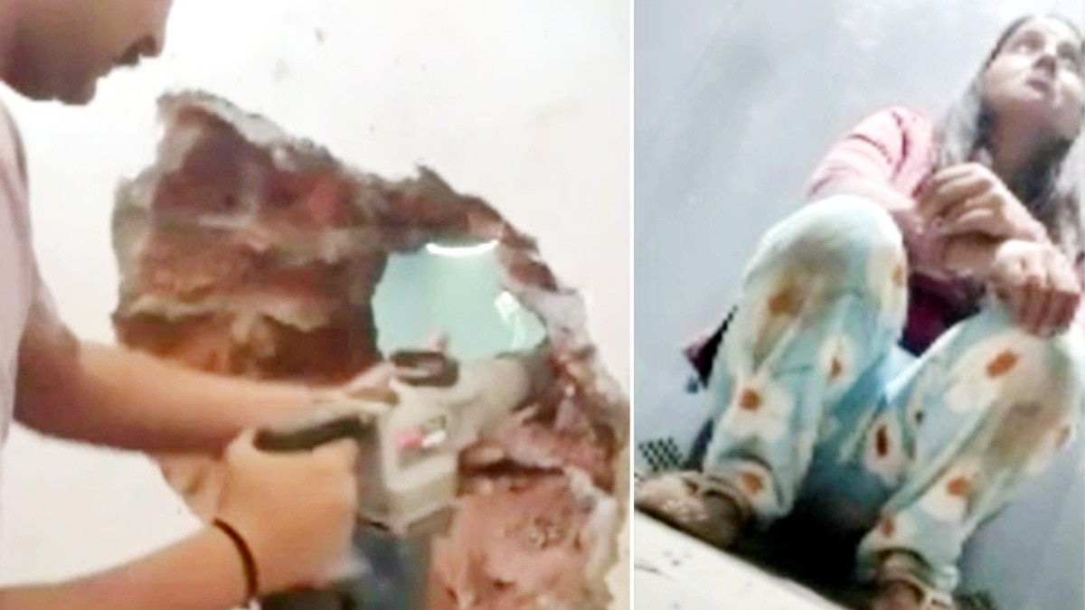 ड्रिल मशीन से दीवार फोड़कर निकाली गई महिला.(Photo:Screengrab)