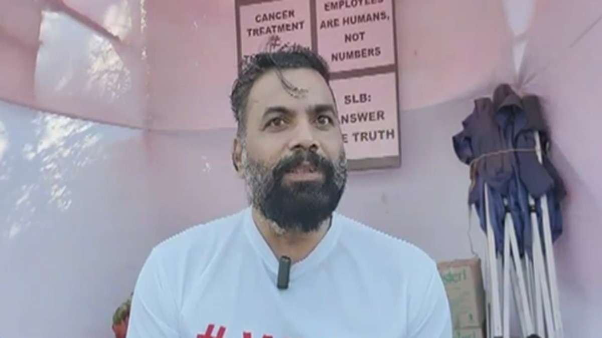 man sitting in protest