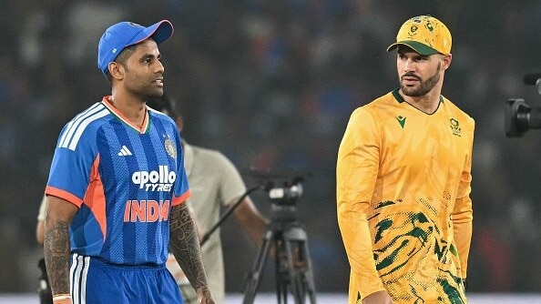 South Africa's captain Aiden Markram (R) and India skipper Suryakumar Yada in frame