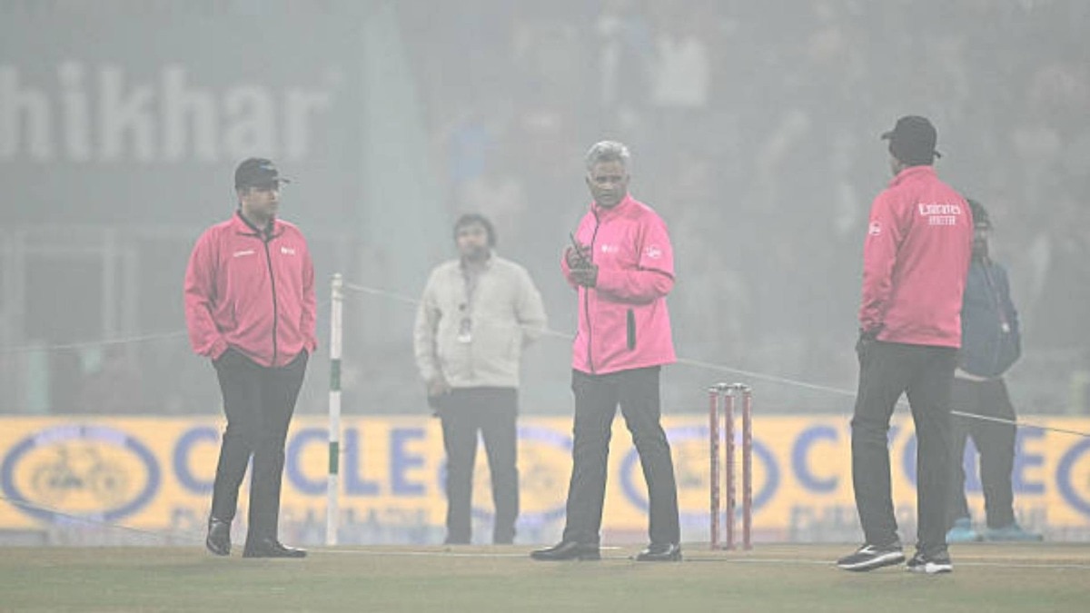 Officials inspect the pitch during the fourth Twenty20 international cricket match between India and South Africa at the Ekana Cricket Stadium in Lucknow