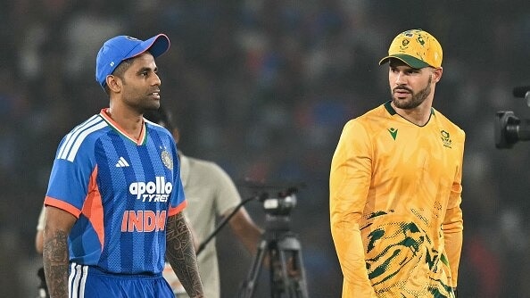 South Africa's captain Aiden Markram (R) and India skipper Suryakumar Yada in frame
