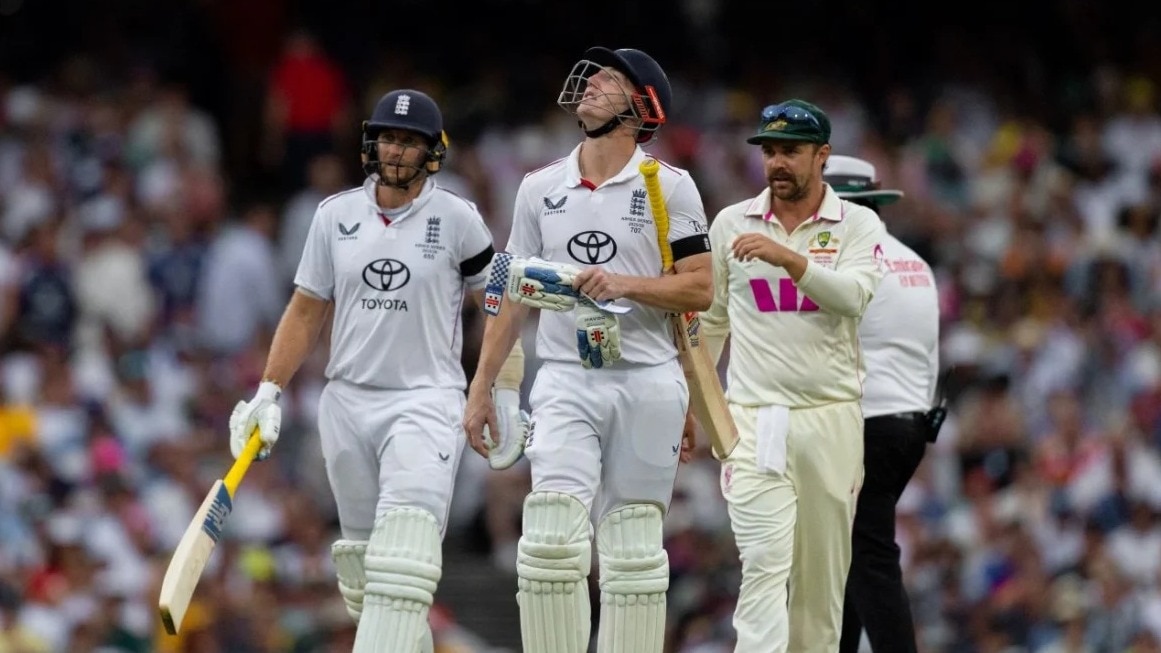 Joe Root and Harry Brook leave the field