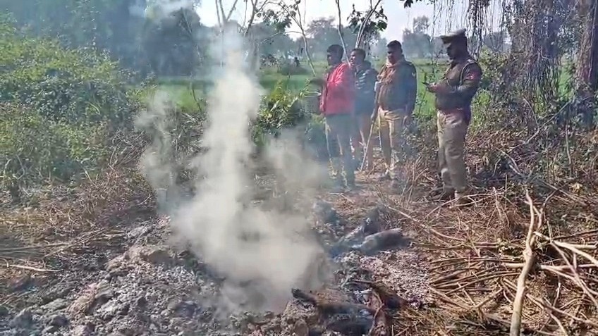Kasganj police extinguished burning pyre (Photo - Screengrab)
