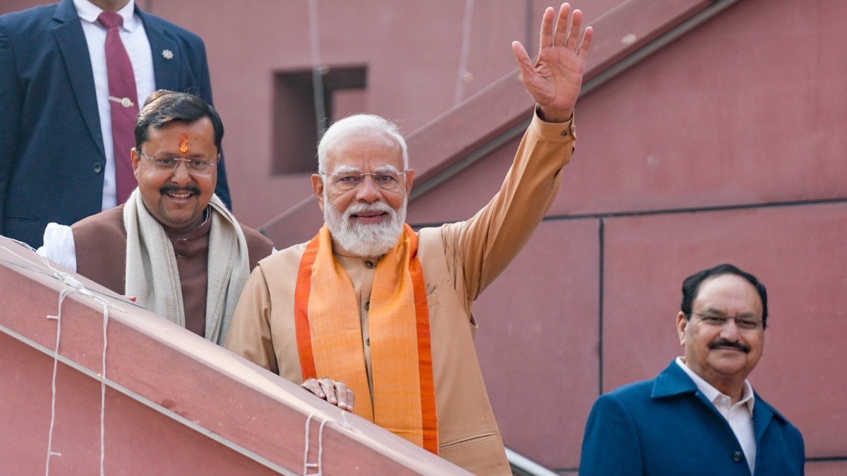 Prime Minister Narendra Modi with newly elected BJP National President Nitin Nabin and Union Minister and outgoing party president JP Nadda during Nabin taking charge ceremony