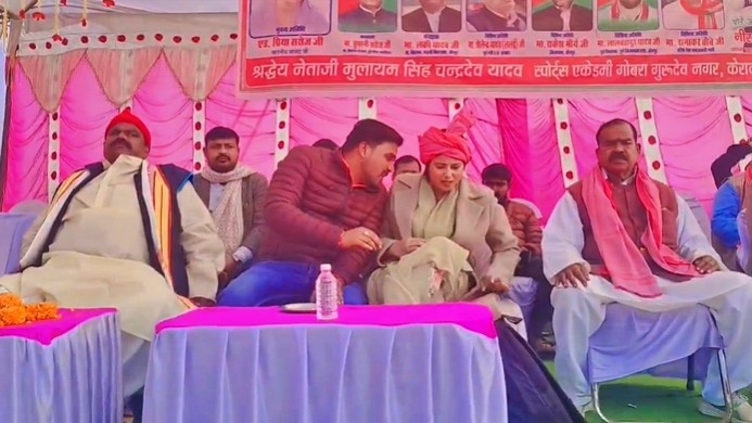 supporter sitting next to MP Priya Saroj (Photo - Screengrab)