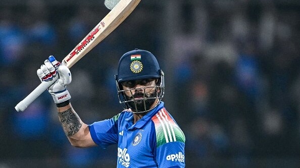 India's Virat Kohli celebrates after scoring a century (100 runs)