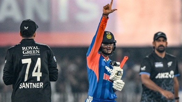 Abhishek Sharma (C) celebrates after scoring a half-century (50 runs) during the third Twenty20 international cricket match between India and New Zealand at the Barsapara Cricket Stadium in Guwahati
