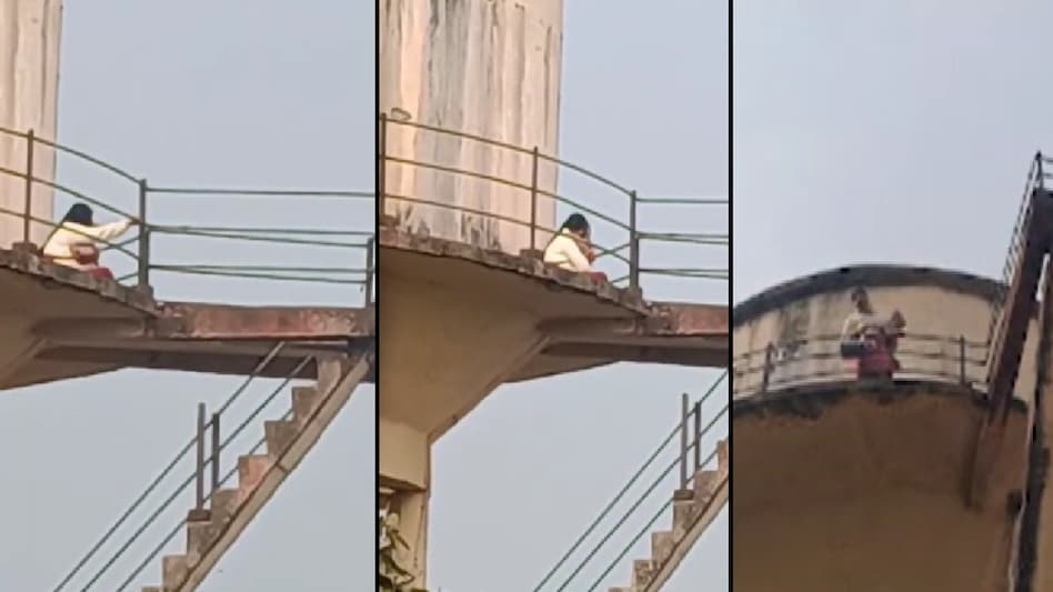 MP Woman Climbs 60-Foot Water Tank with Child Amid Family Dispute, Safely Rescued MP Woman Climbs 60-Foot Water Tank with Child Amid Family Dispute, Safely Rescued