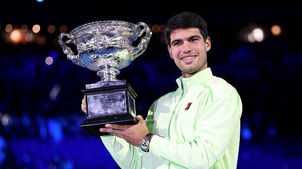 Carlos Alcaraz of Spain poses with the Norman Brookes Challenge Cup at the presentation ceremony after his victory in the Men's Singles Final