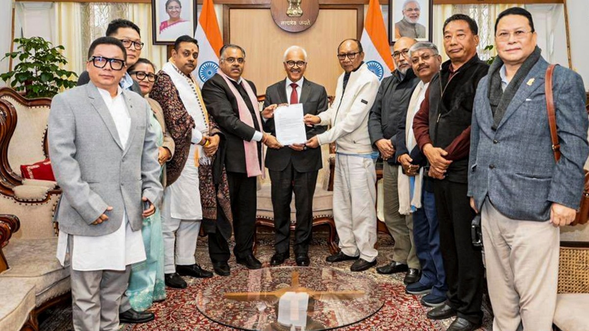 Manipur Governor Ajay Bhalla, centre, meets BJP Manipur leader Yumnam Khemchand Singh, fifth right, and others, who submitted the claim to form a BJP-led NDA government